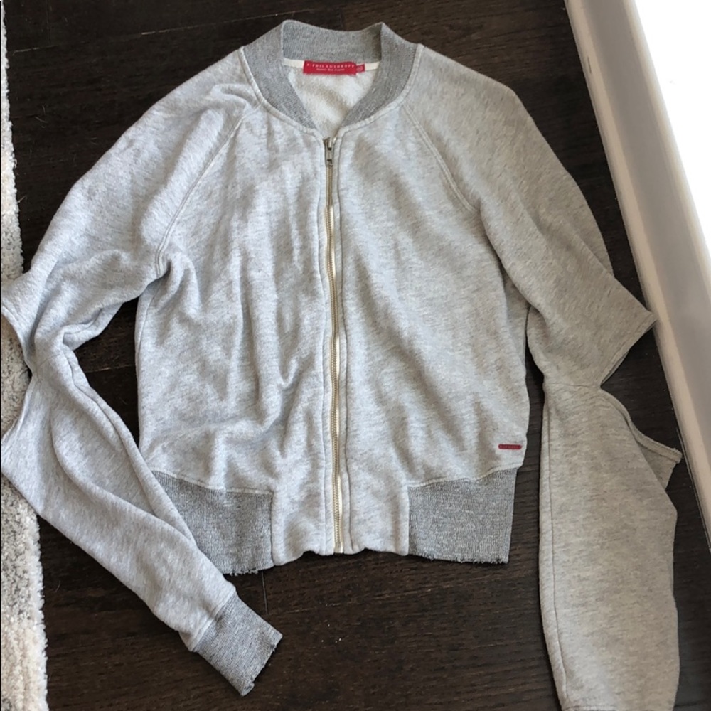 Zip up sweater with cut out elbows